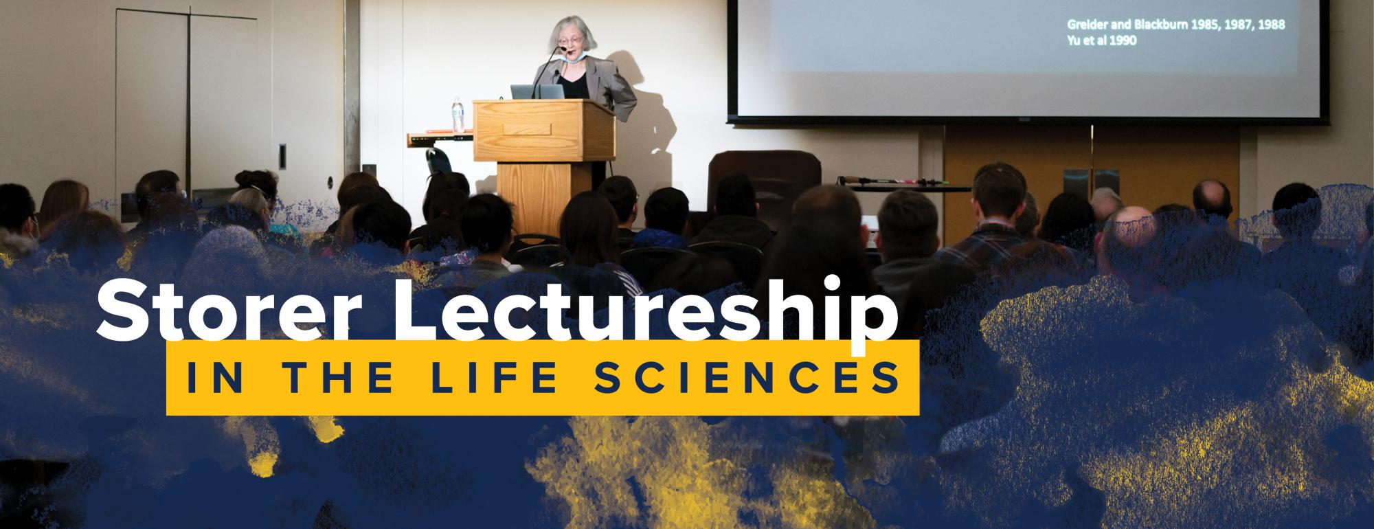 Storer web header featuring female speaker at a podium before a full audience. Blue and gold watercolor overlay are on top of the audience. 