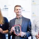 Undergraduate student Kate Borchardt, graduate student Chris Nosala and faculty member Neil Hunter stand with their plaques for the Chancellor's Award for Excellence in Undergraduate Research. Daniel Oberbauer 