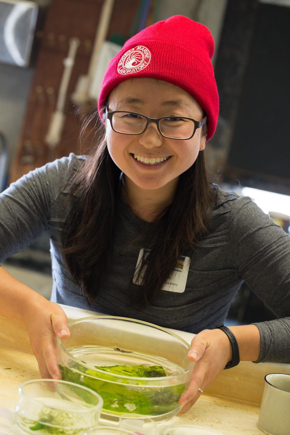 Grace Ha sits in the lab