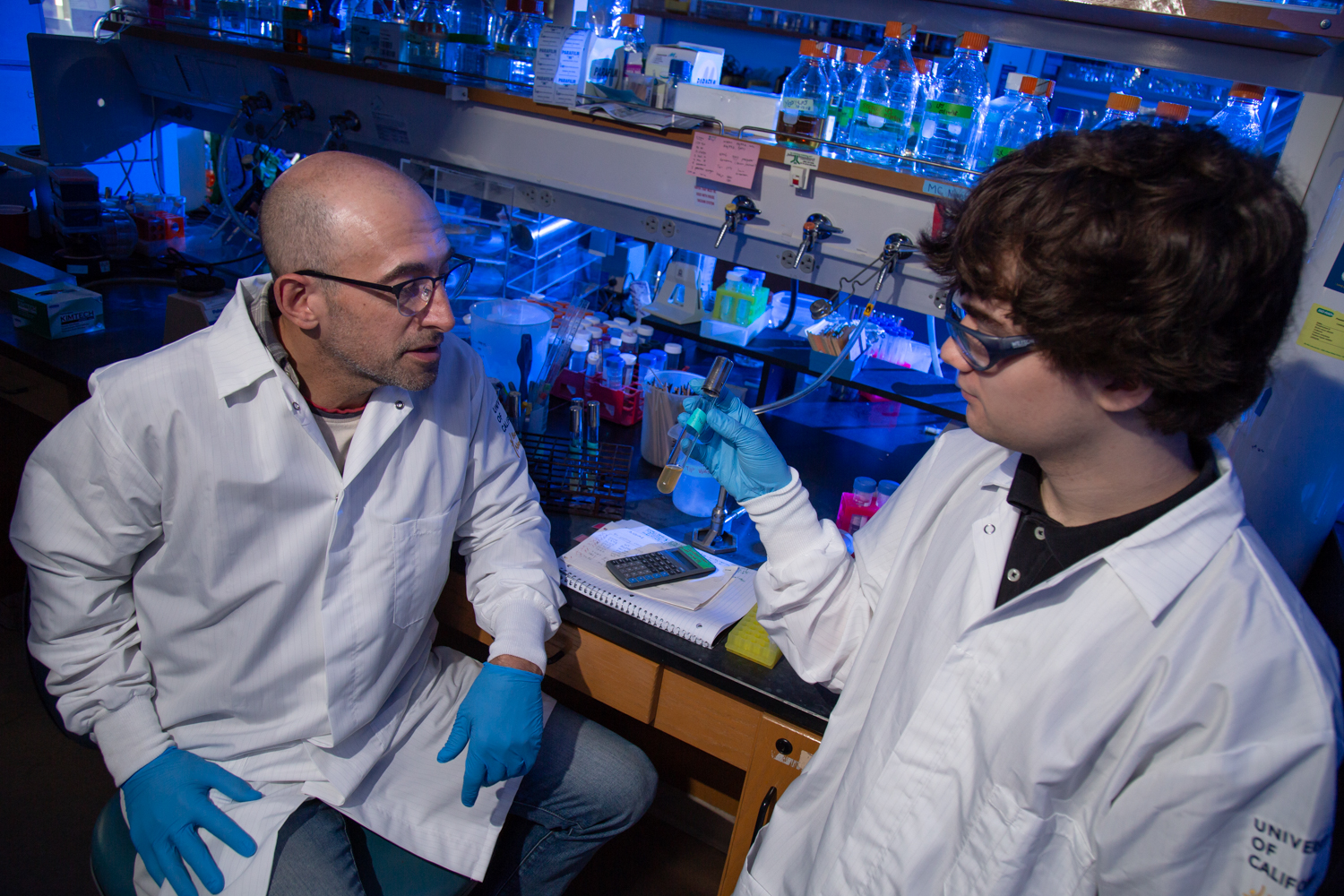 Professor Ken Kaplan and student Mackenzie Noon discuss in the lab