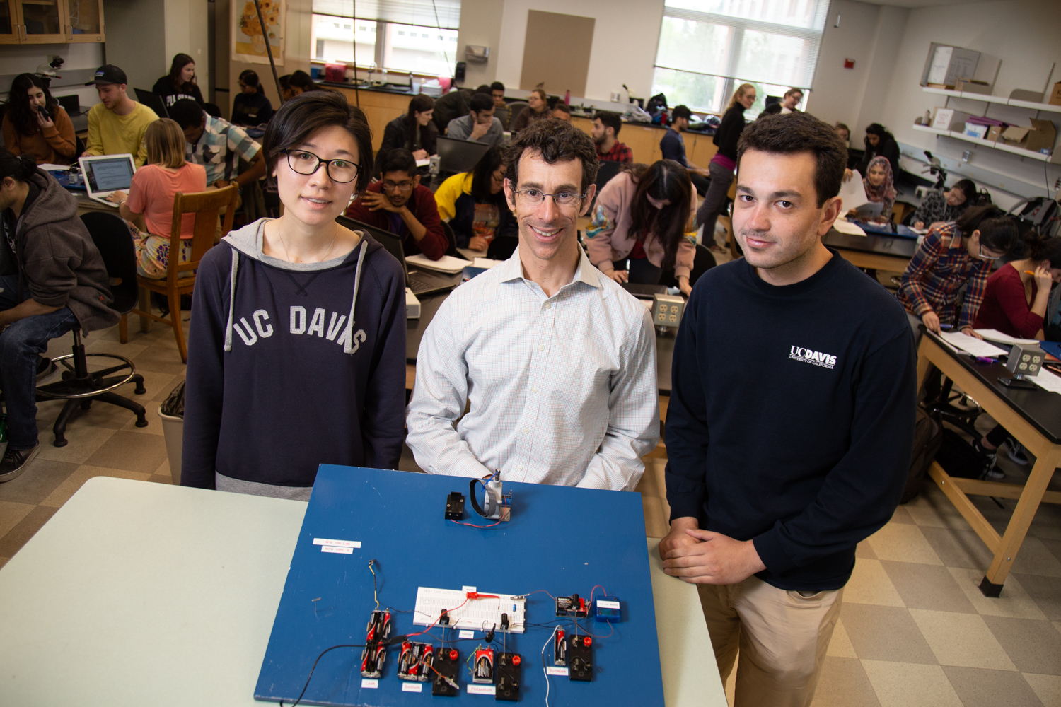 Mark Goldman poses with students