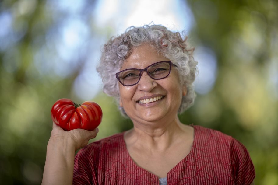Neelima Sinha poses with a tomato