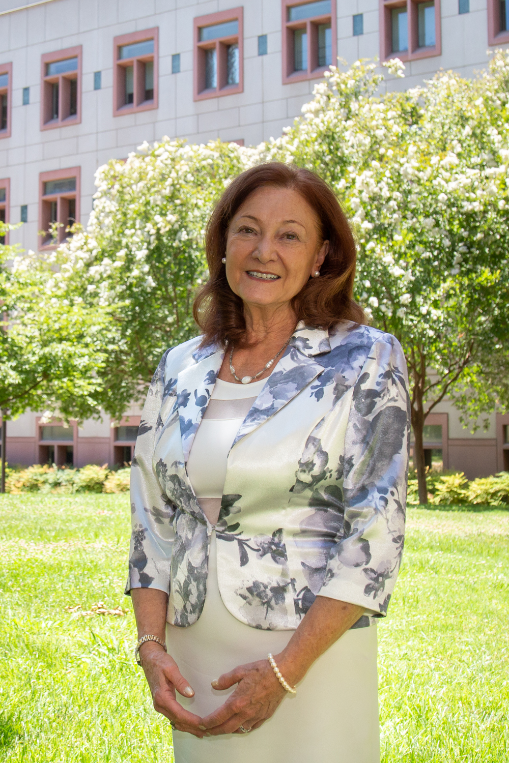 Lin Weaver stands in the courtyard outside the Life Sciences Building