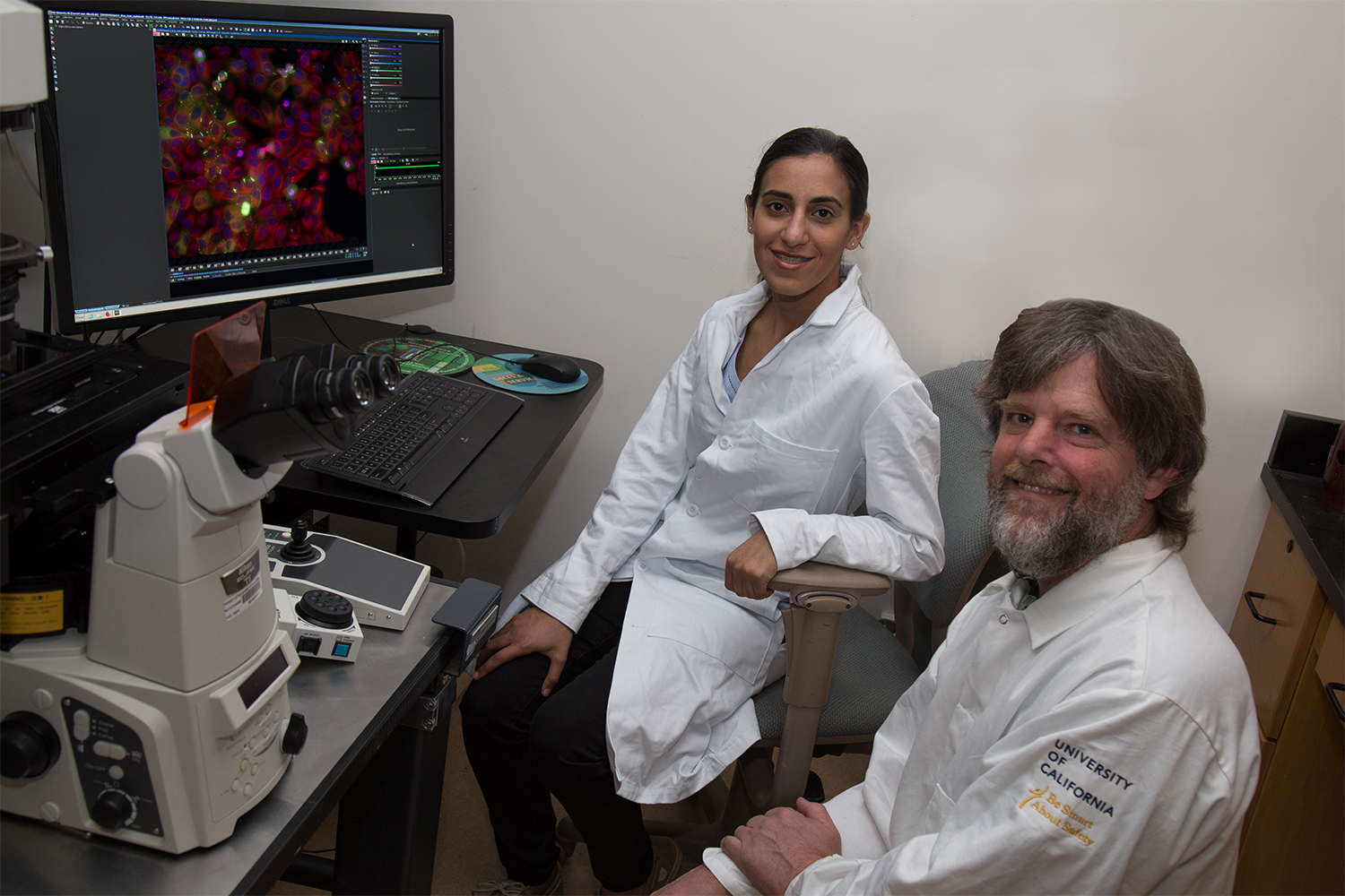 Bita Shahrvini (left) sits next to Assistant Professor Enoch Baldwin (right), who helped Sharhvini further her undergraduate research interest in enzymology, the study of enzymes. David Slipher/UC Davis 