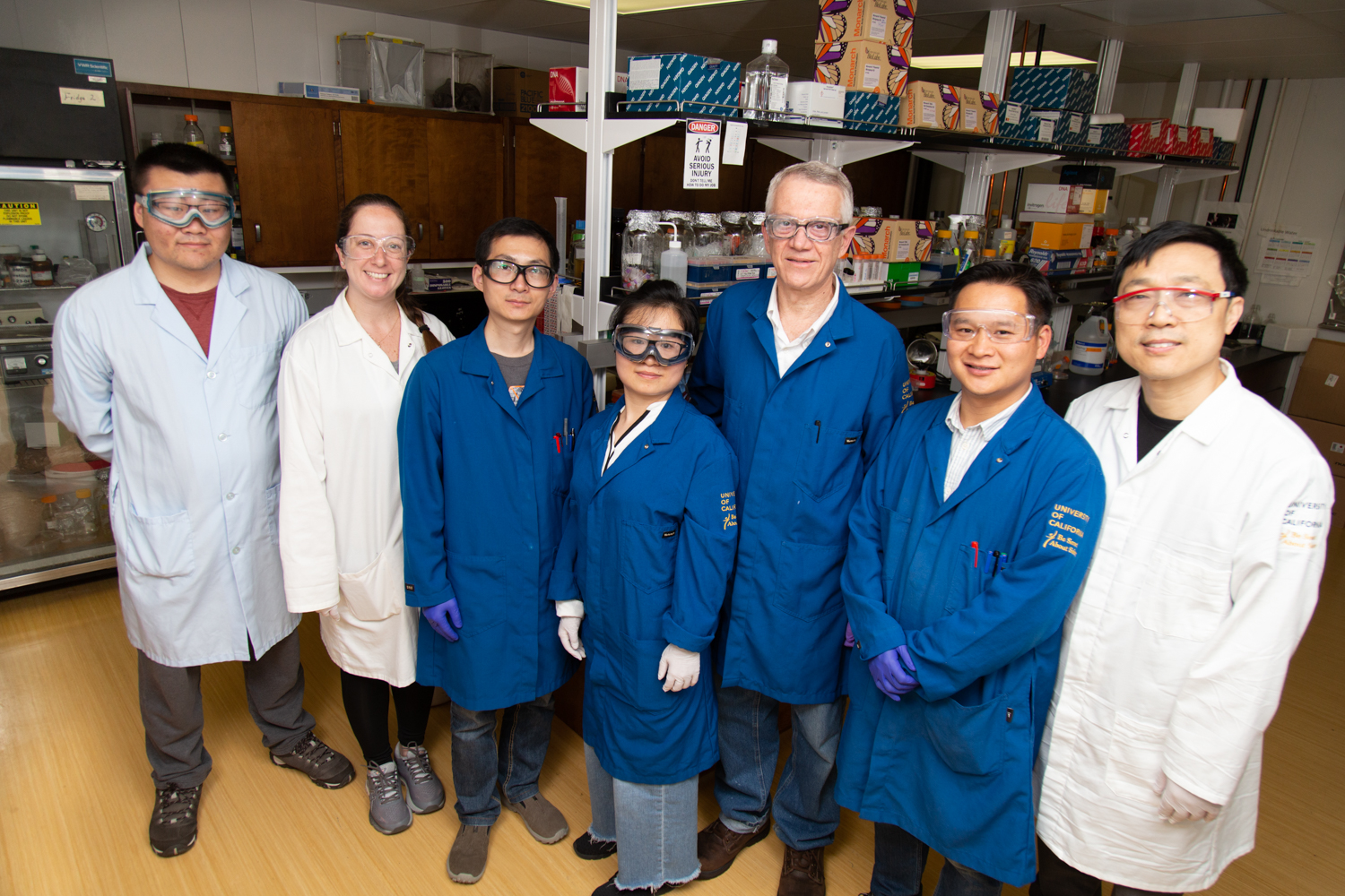 Walter Leal stand with his lab members