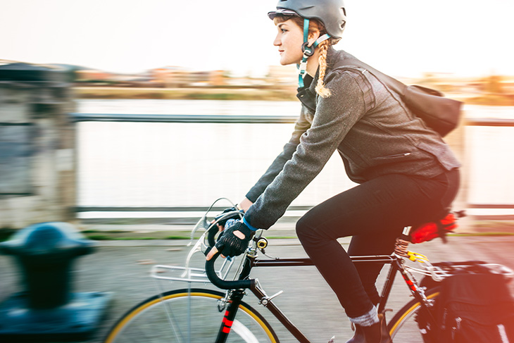 Woman riding on bicycle.