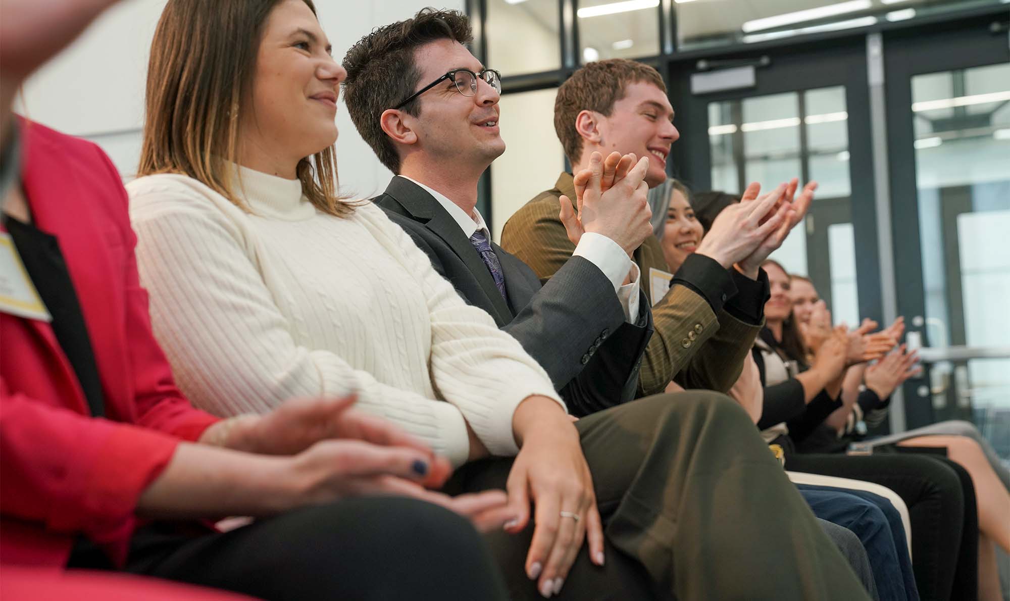 Group of students applauding 