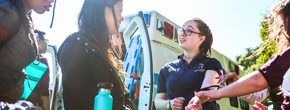 EMT and students in interactive outdoor activity