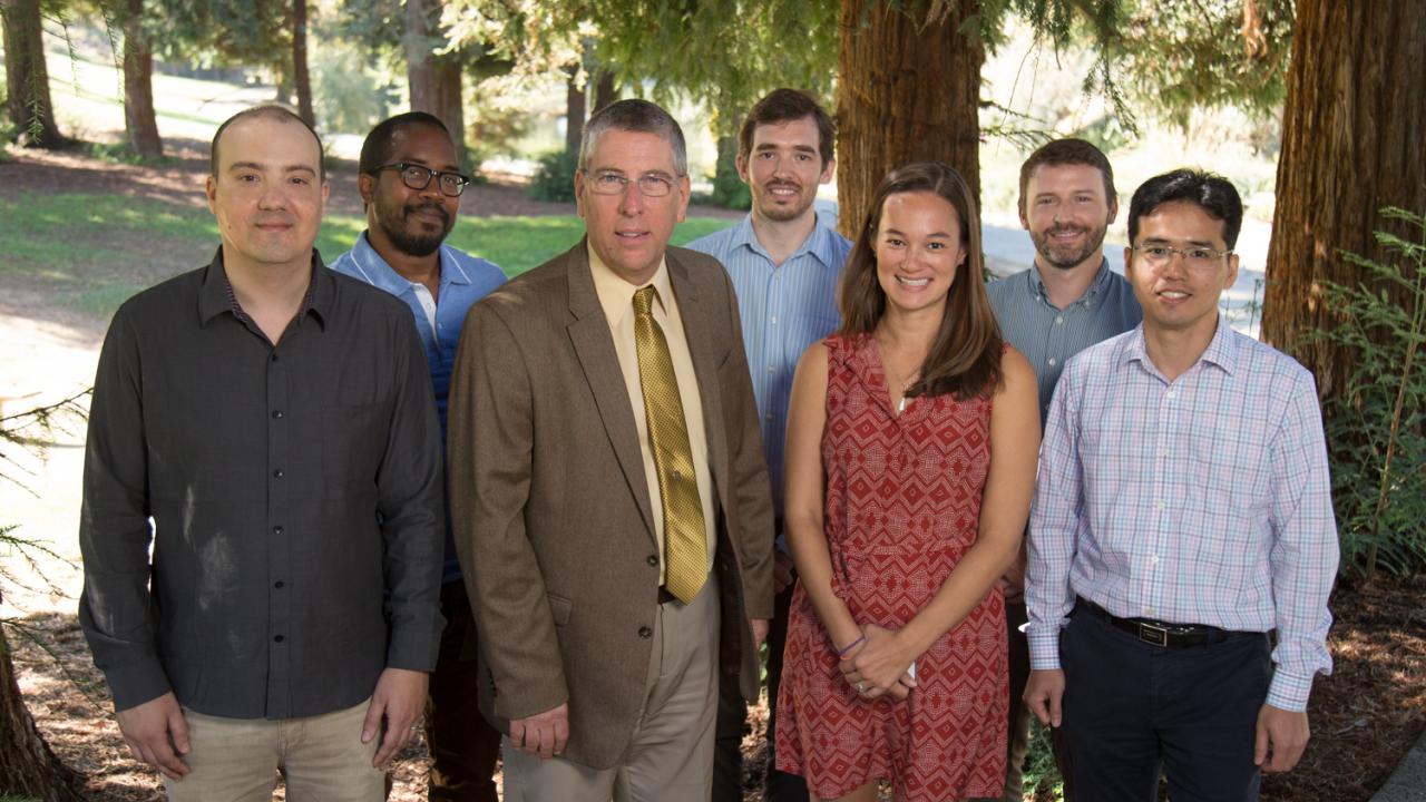 New College of Biological Sciences faculty stand with Dean Mark Winey