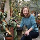 Jennifer Gremer examines a plant