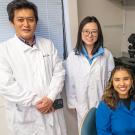 Researchers in the Department of Microbiology and Molecular Genetics have identified a little-known protein that may play a central role in the development of sperm. Satoshi Namekawa (left) project scientist Mengwen Hu (middle) and Jasmine Esparza (right) collaborated on the paper, published in Genes and Development. (Sasha Bakhter / UC Davis)