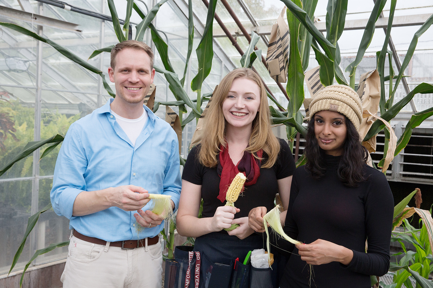 Philipp Zerbe stands with graduate students Katie Murphy and Prema Karunanithi.