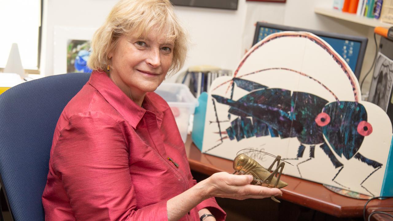 Ann Hedrick researches the mating behaviors of the field cricket Gryllus integer, trying to determine which heritable traits attract a mate. David Slipher/UC Davis Ann Hedrick holds up a cricket statue in her office. David Slipher/UC Davis