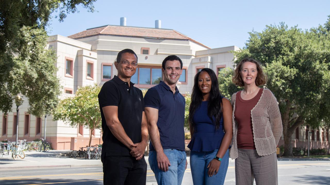EEOP Director Connie Champagne, right, stands with (from left to right) Professor Aldrin Gomes and students Leib Lipowsky and Tayler Smith, who are part of the Biology Undergraduate Scholars Program. BUSP will act as a feeder program to ADNR. David Slipher/UC Davis Professor Aldrin Gomes, students Leib Lipowsky and Tayler Smith and BUSP Director Connie Champagne stand outside the Life Sciences Building.