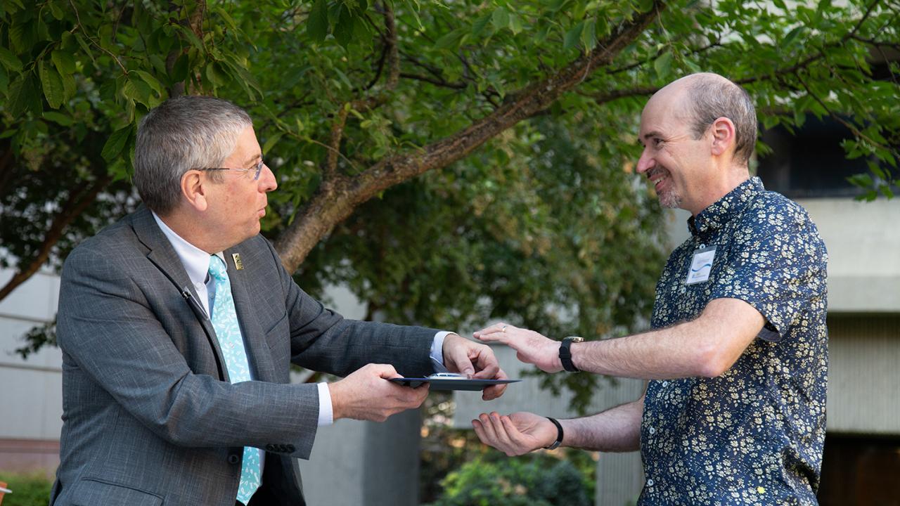 College of Biological Sciences Dean Mark Winey gives the Faculty Teaching Award to Professor Julin Maloof, Department of Plant Biology. Greg Watry/UC Davis Mark Winey and Julin Maloof