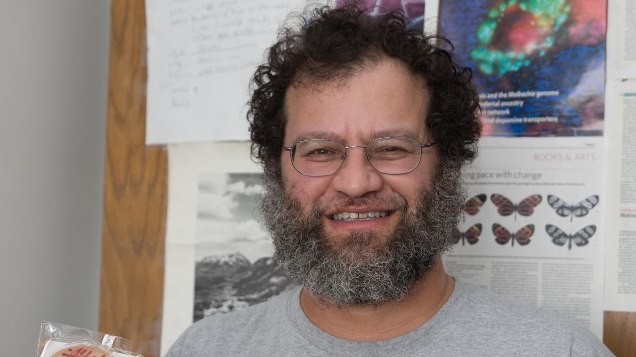 Jonathan Eisen poses in his office holding a bar of soap meant to look like a bacteria slide. (David Slipher/UC Davis) Jonathan Eisen poses in his office holding a bar of soap meant to look like a bacteria slide. (David Slipher/UC Davis)