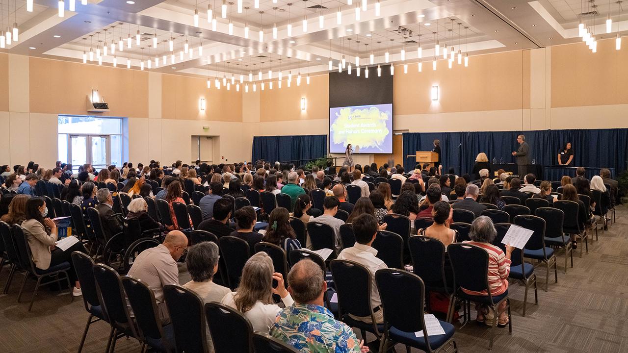Crowd seated before award ceremony stage in the ARC ballroom