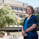 Michele Igo stands in the courtyard outside the Life Sciences Building
