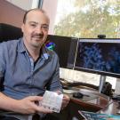 Assistant Professor Nitzan Shabek sits in his lab