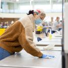 Student cleaning arc testing station