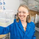 Celina Juliano holding small plastic container