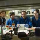 Aldrin Gomes and students in lab