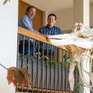 Rick Grosberg (left) served for 10 years as the Coastal and Marine Sciences Institute’s director, a post that will now be filled by interim director Jay Stachowicz (right). Grosberg and Stachowicz are pictured on the landing of Storer Hall, beside the right whale skeleton that hangs in the main entryway. (TJ Ushing / UC Davis)