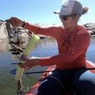 Female student on a red kayak 