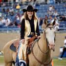 Young woman and horse during a football game