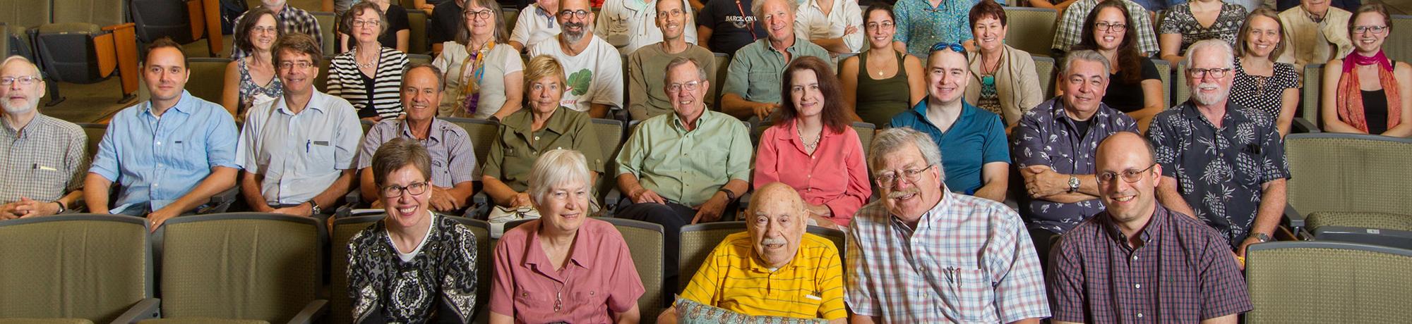 A large crowd of people gathered in the audience of a Storer event. 