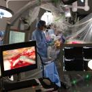 surgeon in operating room performing flim system surgery